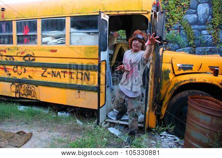 MUSKOGEE, OK - Sept. 12: Bloody zombies hide in school bus during the Castle Zombie Run at the Castle of Muskogee in Muskogee, OK on September 12, 2015. 
