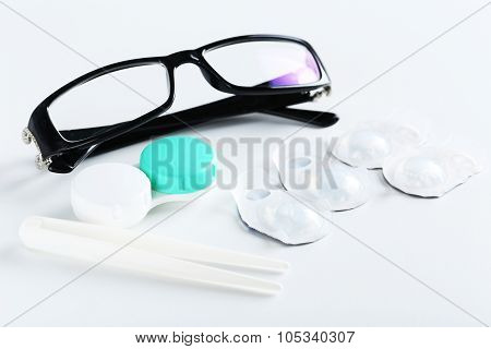 Contact Lenses In Container With Solution On White Background