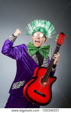 Funny man playing guitar in musical concept
