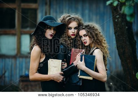 three vintage women as witches