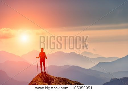 Woman At The Top Of A Mountain