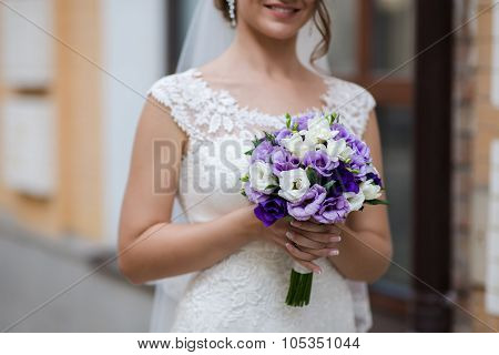 Bouquet Of Flowers In Hands Of A Woman Bride