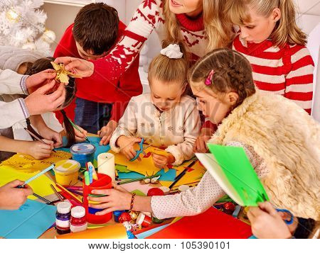 Children painting and cut sissors paper at art school. Education.
