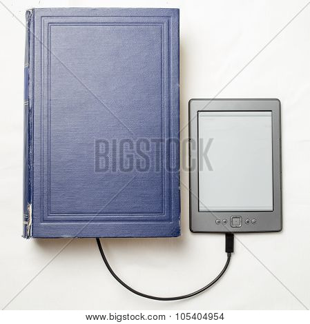 eBook connected to the old thick blue book with a cable