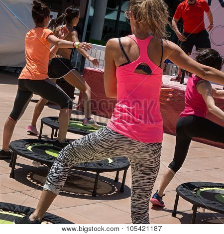 Pretty Girl Doing Fitness On Mini Trampoline