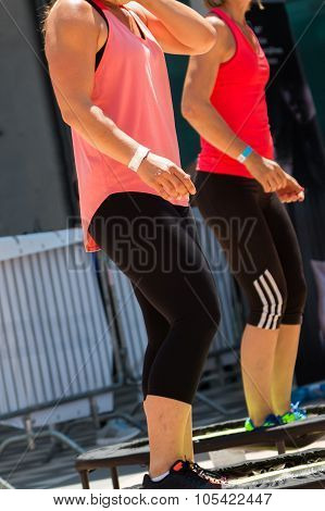 Two Pretty Girls Doing Fitness On Mini Trampoline