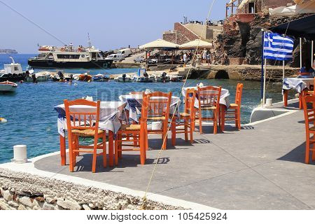 Greek Tavern With Orange Wooden Chairs, Santorini , Greece