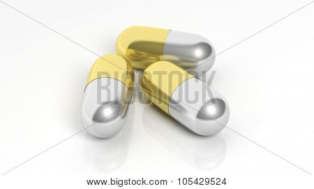 Gold and silver caplets, isolated on white background.