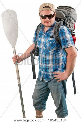 Tourist man with backpack and paddle