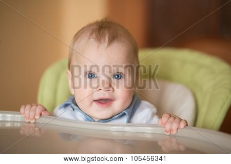 Babyboy Eating In High Chair
