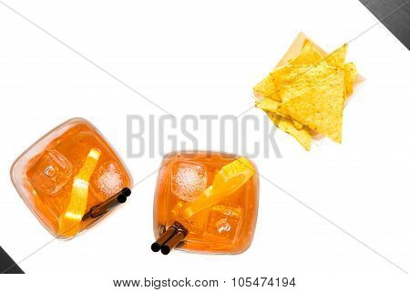 Top Of View Of Hot Tacos Chips In Front Of Two Glasses Of Spritz Aperitif Aperol Cocktail With Orang