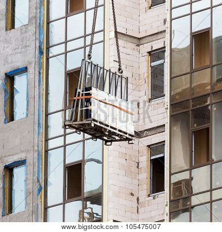 Glazed Windows Double-glazed Windows In The Construction Of High-rise Buildings, Raises A Crane