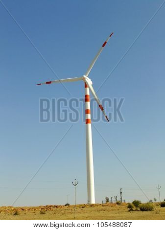 Wind turbine in Thar desert near Jaisalmer Rajasthan India. Thar desert forms a natural boundary between India and Pakistan