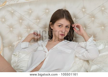 Portrait Of A Cute Girl On The Bed