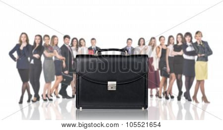 Black briefcase foreground and business peole