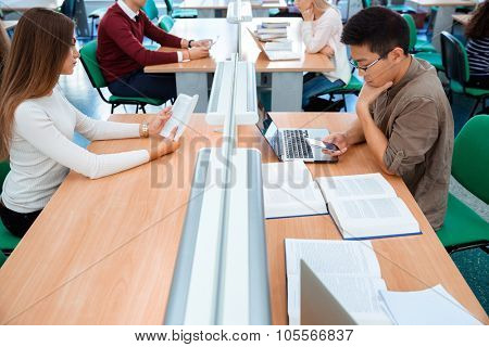 Portrait of a students studying in library