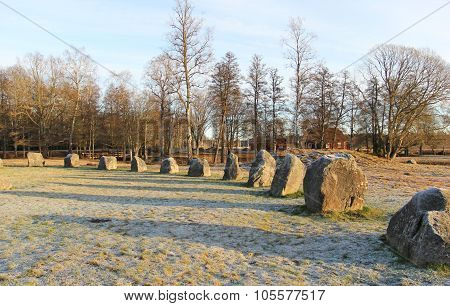 The Big Stones Standing In The Snow Field In Winter