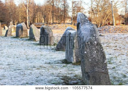 The Big Stones Standing In The Snow Field In Winter