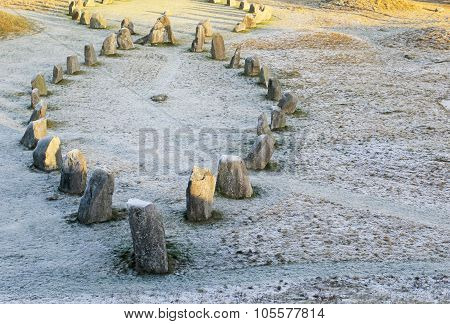 The Big Stones Standing In The Snow Field In Winter
