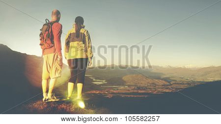Adventurists Beautiful Sunrise Backpacker Climbing Concept