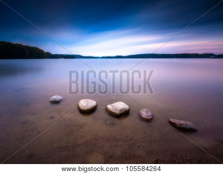 Long Exposure Landscape Of Lake Shore