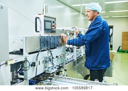 pharmaceutical factory man worker operating production line at pharmacy industry manufacture factory