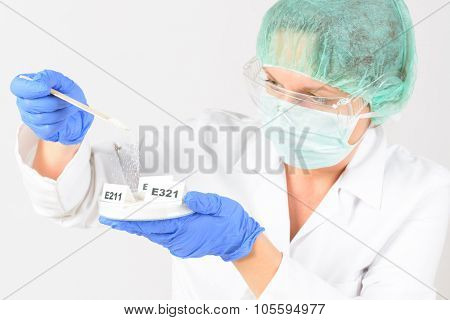 Researcher presenting preservatives substances that are added to products such as foods, pharmaceuticals, paints, biological samples, wood etc.