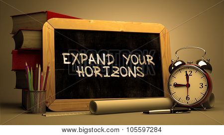 Handwritten Expand Your Horizons on a Chalkboard.