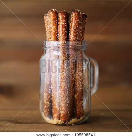 pretzel sticks in mason jar with turbinado sugar and sea salt