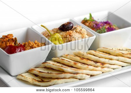 Harissa hummus feta ajvar and pita bread