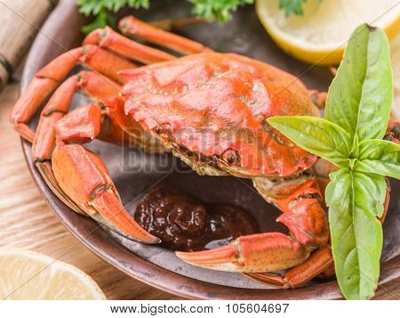 Seafood dish - cooked crab with lemon and herbs.