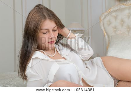 Portrait Of A Cute Girl On The Bed