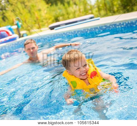 Child playing in swimming pool