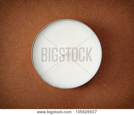 Round Candle On The Brown Background