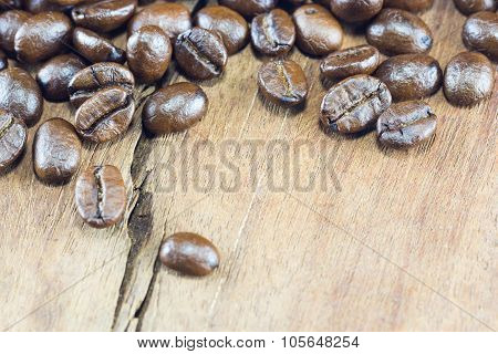 Coffee Beans  Texture  On The Wood Background