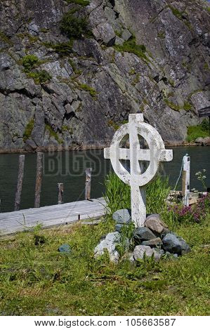 Celtic cross along the shore in Quidi Vidi which is part of St. John's, Newfoundland, Canada.