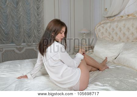 Portrait Of A Cute Girl On The Bed