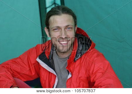 Guy Sitting In The Tent