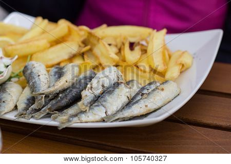 Sardelien with potatos. Seafood.