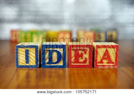 Word Of Idea Spelled With Colorful Wooden Alphabet Blocks.