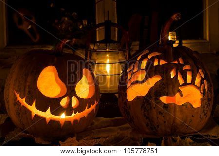 Photo Composition From Two Pumpkins On Halloween. Jack And Awful Hands Against An Old Window, Dry Le