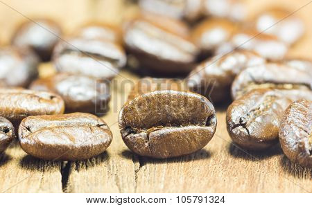 Coffee Beans  Texture  On The Wood Background,selective Focus,worm Toning