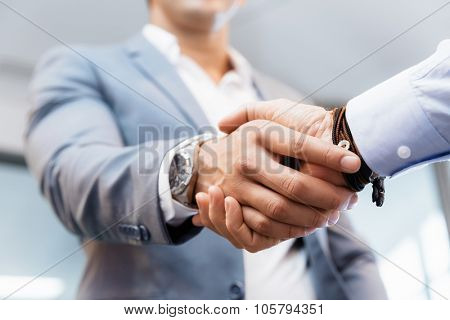 Handshake of businessmen greeting each other