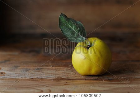 Quince on wooden table