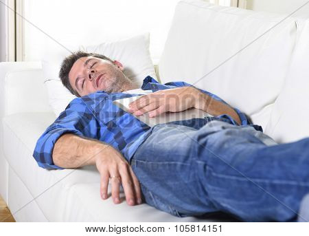 Young Attractive Man Sleeping At Home Couch Relaxing After Working With Digital Tablet Pad