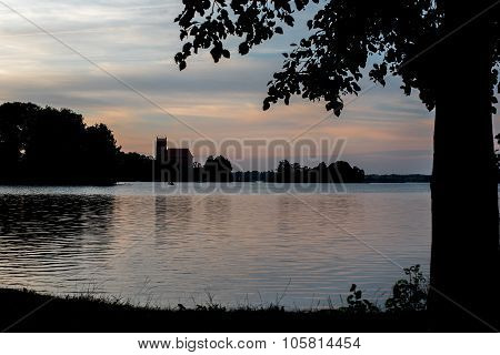 Silhouette of famous Trakai Island Castle in Lithuania next to Vilnius. Landmark in historical capital city of Grand Duchy of Lithuania, located in Galve lake