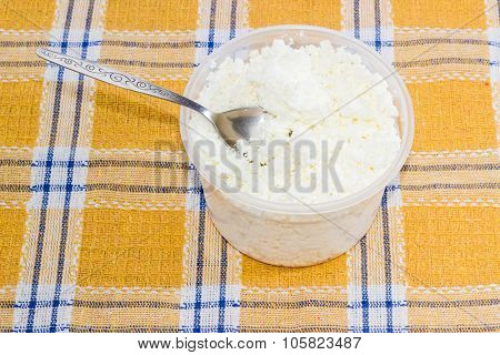 Container Of Cottage Cheese With Tea Spoon