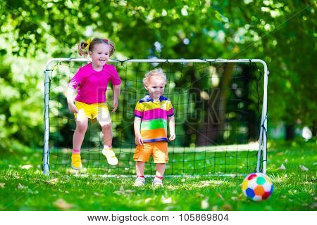 Kids Playing Football In School Yard