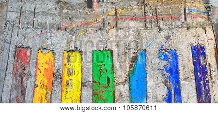 Abstract Background. The Concrete Wall Painted In Colors Of A Rainbow.