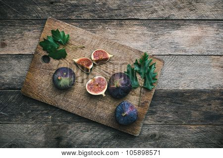 Ripe Figs On Chopping Board And Wood